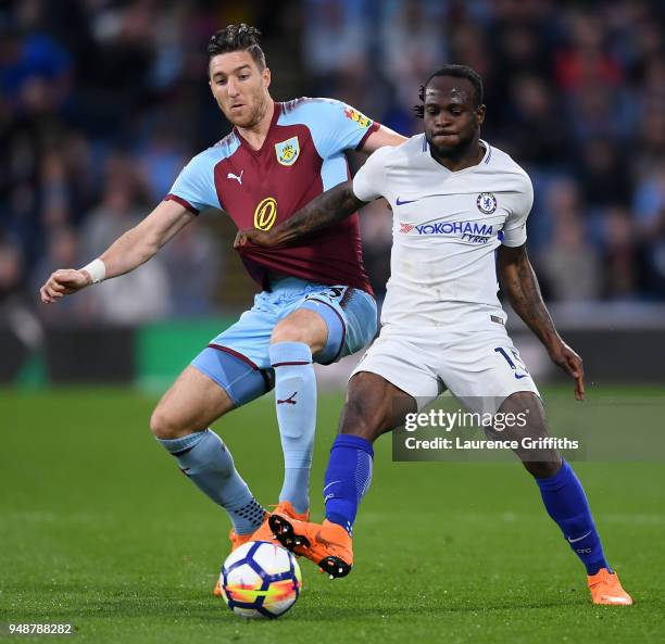 Victor Moses of Chelsea is challenged by Stephen Ward of Burnley during the Premier League match between Burnley and Chelsea at Turf Moor on April...