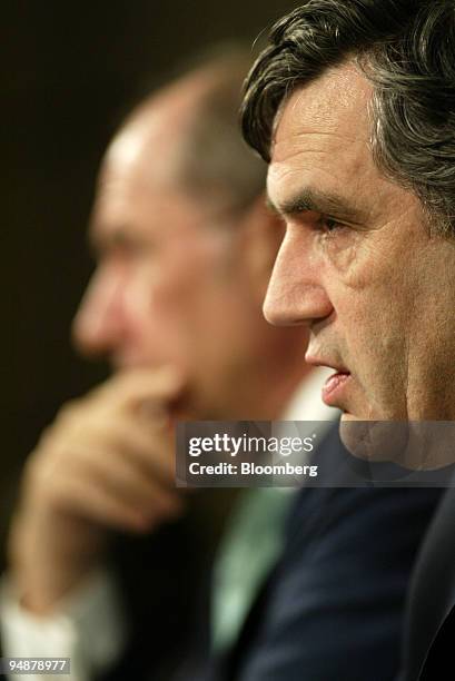 Gordon Brown, International Monetary and Financial Committee Chairman, right, speaks during a joint press conference with Rodrigo de Rato,...