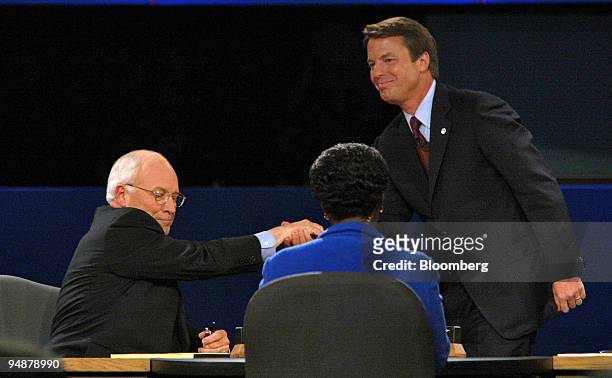 Vice President Dick Cheney, left, and Senator John Edwards shake hands after the Vice Presidential Debate at Case Western Reserve University in...
