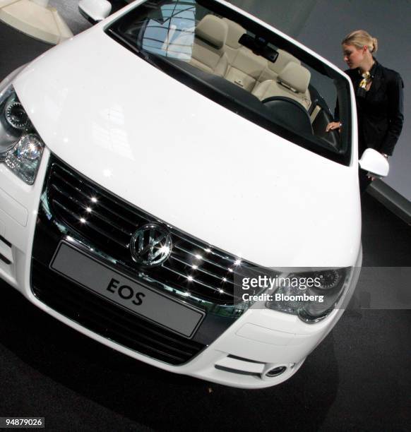 Linda Vespermann looks at a Volkswagen Eos automobile at the company's annual earnings news conference in Wolfsburg, Germany, on Thursday, March 13,...