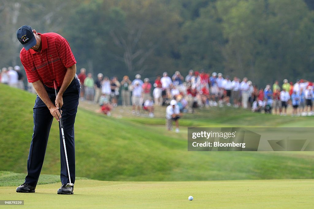 Stewart Cink of the U.S. team hits a birdie putt on the 4th