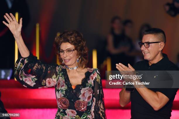 Actress Sofia Loren and fashion designer Stefano Gabbana gesture prior the Dolce & Gabbana Alta Moda and Alta Sartoria collections fashion show at...