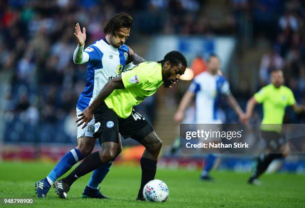 Anthony Grant of Peterborough United and Bradley Dackin of Blackburn Rovers in action during the Sky Bet League One match between Blackburn Rovers...