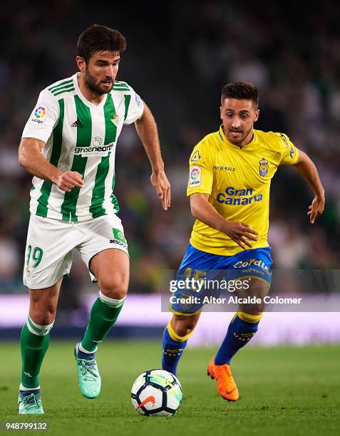 Antonio Barragan of Real Betis Balompie being followed by Ignacio Gil of Union Deportiva Las Palmas during the La Liga match between Real Betis and...