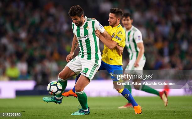 Antonio Barragan of Real Betis Balompie being followed by Ignacio Gil of Union Deportiva Las Palmas during the La Liga match between Real Betis and...