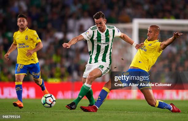 Fabian Ruiz of Real Betis Balompie competes for the ball with Alejandro Galvez of Union Deportiva Las Palmas during the La Liga match between Real...