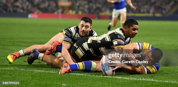 Ryan Hall of Leeds scores a second half try past Jake Connor and Albert Kelly of Hull FC during the BetFred Super League match between Hull FC and...