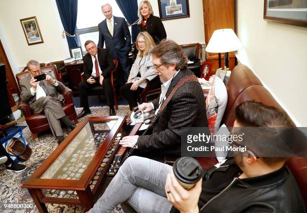 Grammy award-winning musician Jerry Douglas performs for U.S. Rep. Bob Goodlatte , center left, during The Recording Academy's annual GRAMMYs on the...