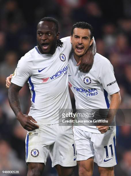 Victor Moses of Chelsea celebrates with teammate Pedro after scoring his sides second goal during the Premier League match between Burnley and...