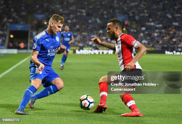 Leicester City's Marc Albrighton battles with Southampton's Ryan Bertrand during the Premier League match between Leicester City and Southampton at...