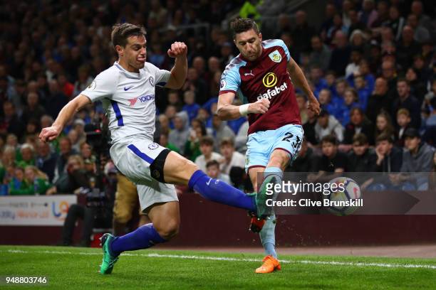 Cesar Azpilicueta of Chelsea battles for possesion with Stephen Ward of Burnley during the Premier League match between Burnley and Chelsea at Turf...