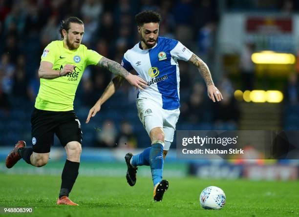 Derrick Williams of Blackburn Rovers and Jack Marriott of Peterborough United in action during the Sky Bet League One match between Blackburn Rovers...