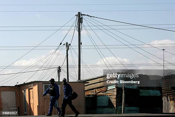 Electricity cables crisscross the skyline in Kayelitsha township on the outskirts of Cape Town, South Africa, Friday, Sept 2005. Millions of homes...