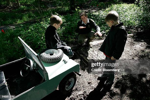 Brothers Milo and Henry Kremer with instructor Mike Coles at the Gleneagles Hotel off road course in Scotland, Sunday, May 29, 2005. With an...