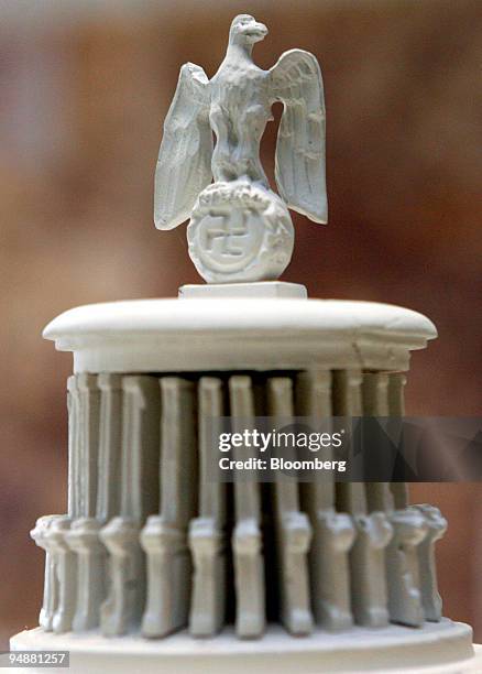 An eagle and a swastika sit atop a model of the 180,000-seat "Great Hall," on display in an exhibit in Berlin, Germany, on Tuesday, March 11, 2008....