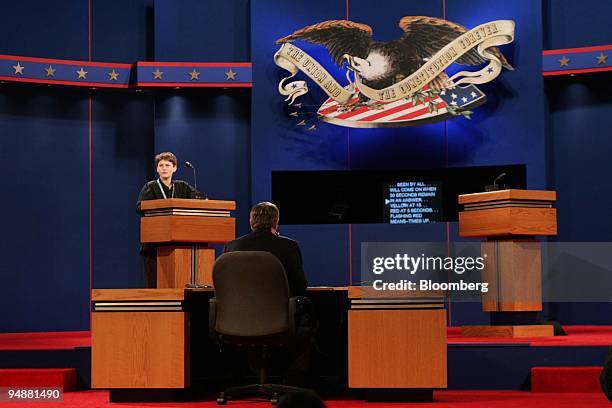 Jim Lehrer, anchor of PBS's "The NewsHour," center, prepares for his role as moderator of the First Presidential debate at the University of Miami...