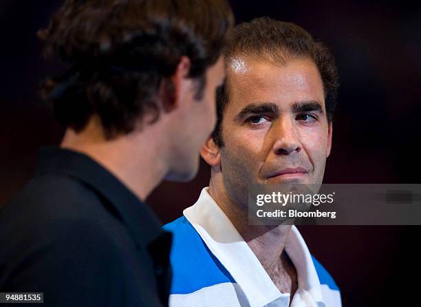 Pete Sampras of the U.S., right, looks to Roger Federer of Switzerland prior to a best-of-three-set exhibition match at Madison Square Garden in New...