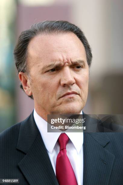 Richard Scrushy listens as his legal team addresses members of the media after leaving federal court in Birmingham, Alabama, Wednesday September 29,...