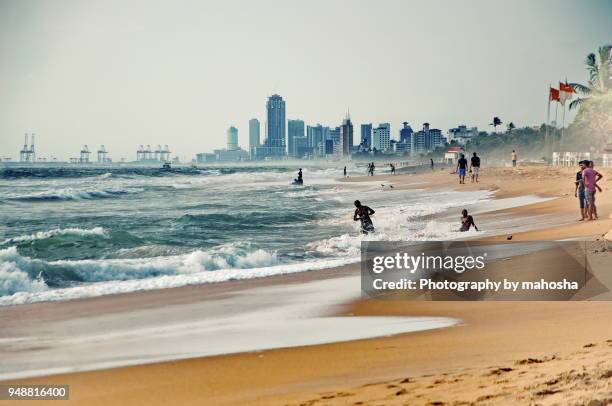 mount lavinia beach looking towards colombo port - colombo stock pictures, royalty-free photos & images