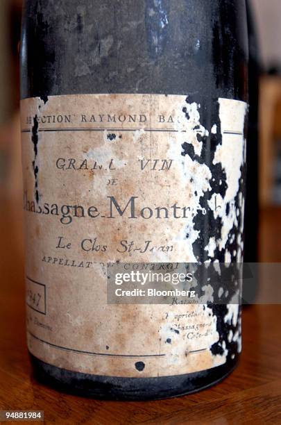 Bottle of Chassagne-Montrachet Clos Saint Jean sits on a table at the los Saint Jean vineyard, in the Burgundy village of Chassagne-Montrachet,...