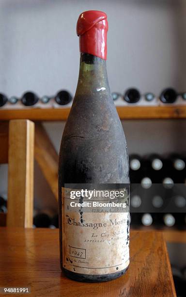 Bottle of Chassagne-Montrachet Clos Saint Jean sits on a table at the los Saint Jean vineyard, in the Burgundy village of Chassagne-Montrachet,...