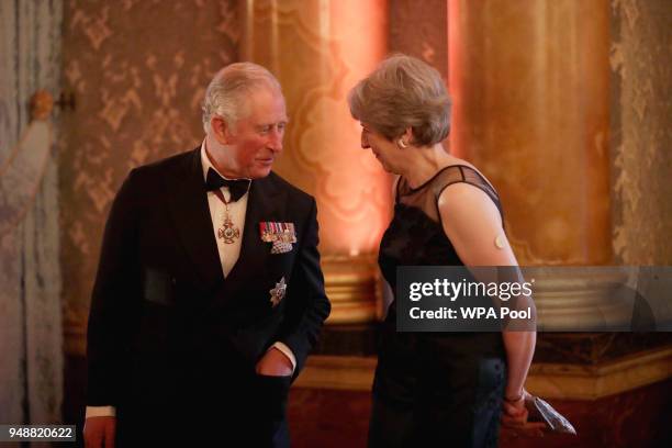 Britain's Prince Charles speaks to Britain's Prime Minister Theresa May before taking part in a receiving line at the Queen's Dinner for the...