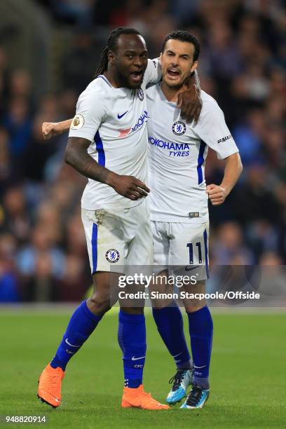 Victor Moses of Chelsea celebrates with teammate Pedro of Chelsea after scoring their 2nd goal during the Premier League match between Burnley and...