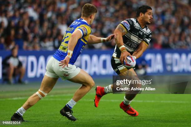 Bureta Faraimo of Hull FC runs with the ball as Ash Handley of Leeds Rhinos chases him down during the BetFred Super League match between Hull FC and...