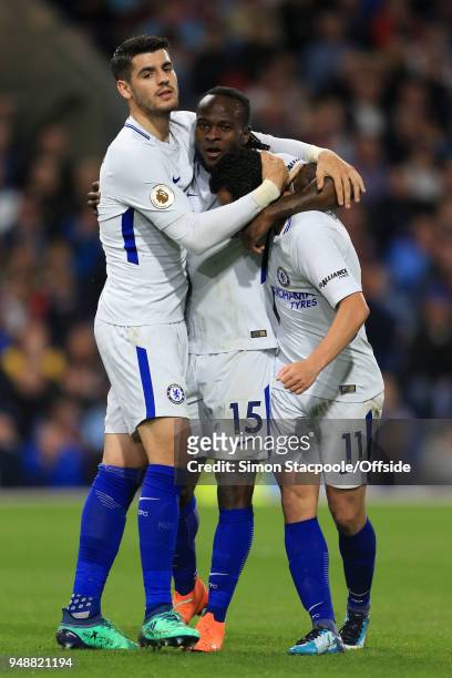Victor Moses of Chelsea celebrates with teammates Alvaro Morata and Pedro after scoring their 2nd goal during the Premier League match between...