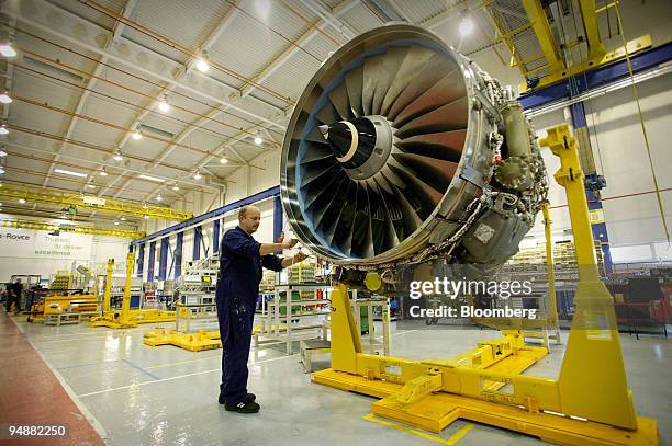 Rolls-Royce engineer works on a V2500/85 jet engine at their Civil Aerospace factory in Derby, U.K., Wednesday, September 21, 2005. With 11,000...