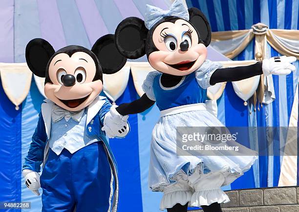 Mickey and Minnie Mouse impersonators perform during a stage show at the Walt Disney World Magic Kingdom in Orlando, Florida, U.S., on Wednesday,...