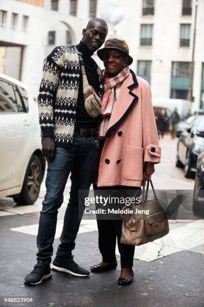 Model Alpha Dia and a friend after the Ferragamo show during Milan Fashion Week Fall/Winter 2018/19 on February 24, 2018 in Milan, Italy. Alpha wears...