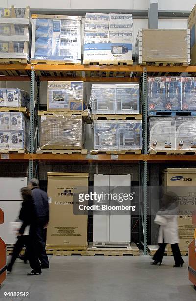 Customers walk by the refrigerators on display at the Costco Warehouse in Dedham, Massachusetts Thursday May 26, 2005. Costco Wholesale Corp., the...