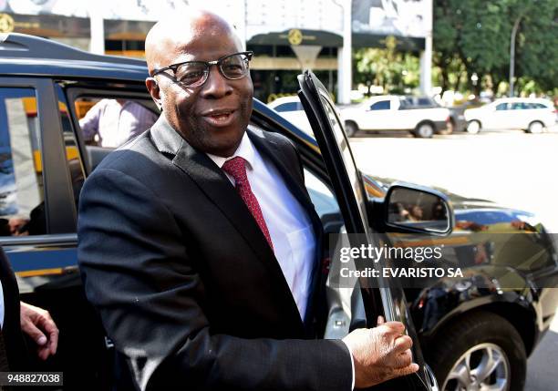 Former Supreme Court judge Joaquim Barbosa arrives at the headquarters of the Brazilian Socialist Party in Brasilia, on April 19 for a meeting to...