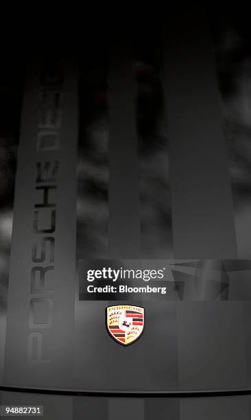 The Porsche AG badge is displayed on the front hood of the Porsche Cayman S Design Edition 1 in Fort Lee, New Jersey, U.S., on Friday, March 7, 2008....