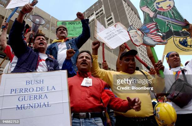 Supporters of President Hugo Chavez and employees of PDVSA protest outside the Vice- Presidential Palace in Caracas, Venezuela on Thursday February...