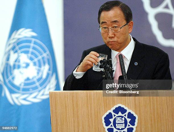 Ban Ki-moon, United Nations secretary-general, takes a drink of water during a joint news conference with Han Seung Soo, South Korea's prime...