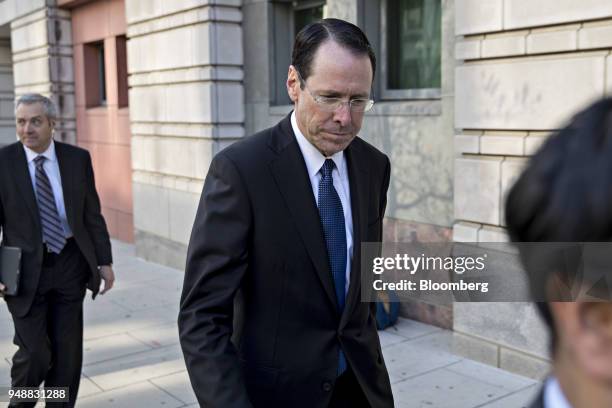 Randall Stephenson, chairman and chief executive officer of AT&T Inc., exits federal court in Washington, D.C., U.S., on Thursday, April 19, 2018....
