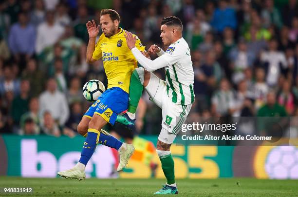 Arnaldo Antonio Sanabria of Real Betis Balompie competes for the ball with Dani Castellano of Union Deportiva Las Palmas during the La Liga match...