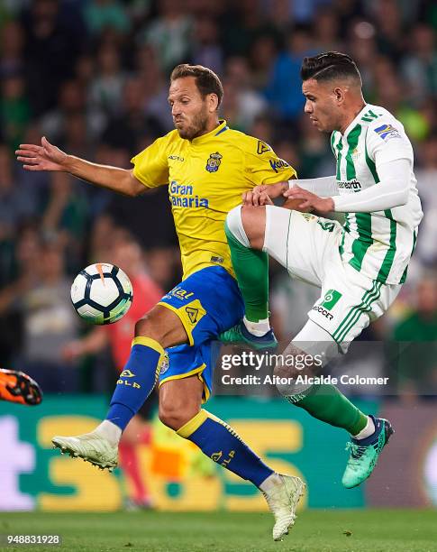 Arnaldo Antonio Sanabria of Real Betis Balompie competes for the ball with Dani Castellano of Union Deportiva Las Palmas during the La Liga match...