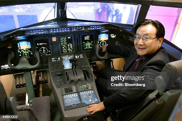 Tang Xiaoping, general manager for commercial aircraft at China Aviation Industry Corp. I, poses in a mockup of the company's ARJ21 regional...