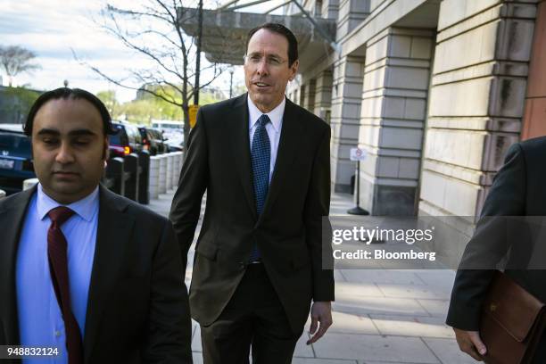 Randall Stephenson, chairman and chief executive officer of AT&T Inc., exits federal court in Washington, D.C., U.S., on Thursday, April 19, 2018....