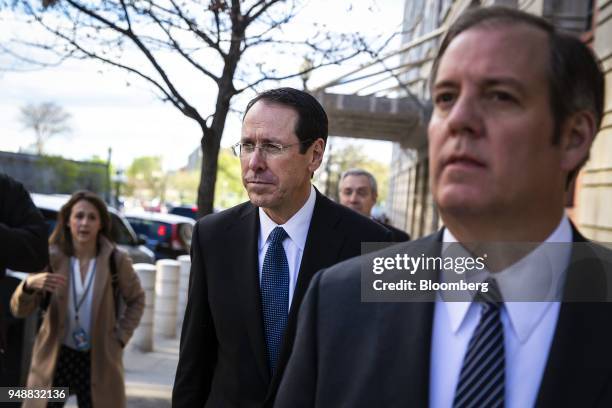 Randall Stephenson, chairman and chief executive officer of AT&T Inc., exits federal court in Washington, D.C., U.S., on Thursday, April 19, 2018....