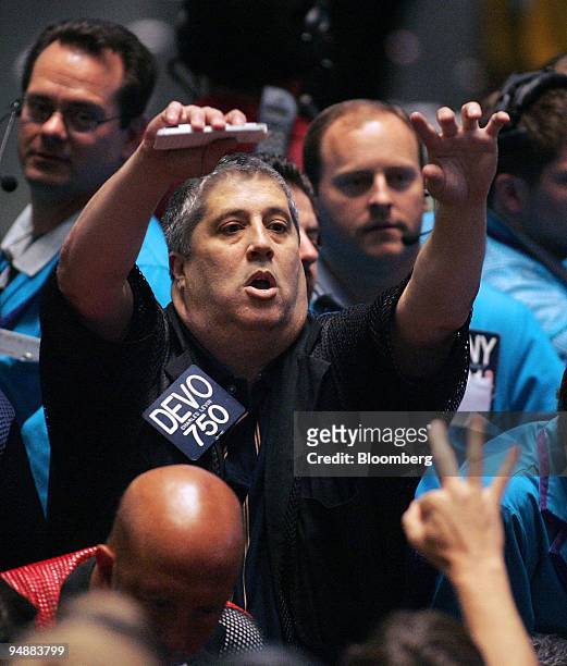 Trader Charles Levin signals an order in the Eurodollar Options pit at the Chicago Board of Trade in Chicago, Illinois, U.S., moments after a Federal...