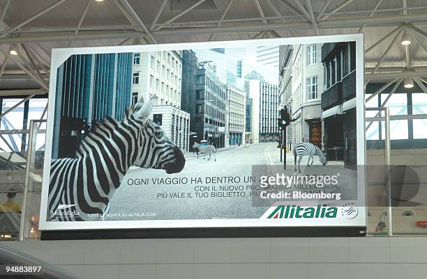 An advertisement for Alitalia airlines hangs in Leonardo da Vinci Fiumicino Airport in Rome, Italy, on Tuesday, June 24, 2008. Alitalia SpA's new...