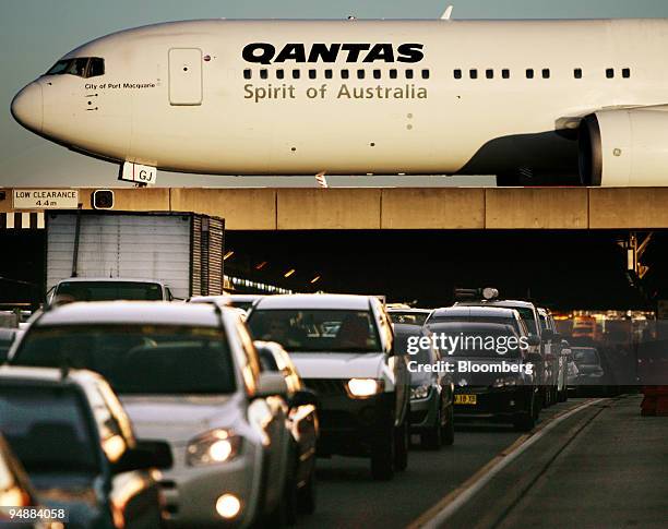 Qantas Airways Ltd. Jet taxis on a bridge over motor traffic in Sydney, Australia, on Monday, June. 23, 2008. Qantas Airways Ltd., Asia's...