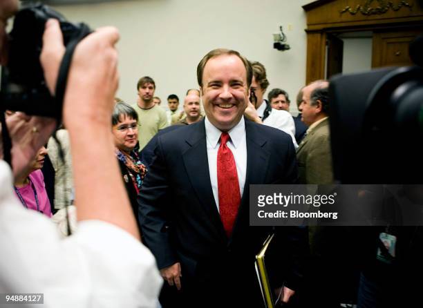 Scott McClellan, former press secretary for U.S. President George W. Bush, smiles at photographers during a break from a House Judiciary Committee...