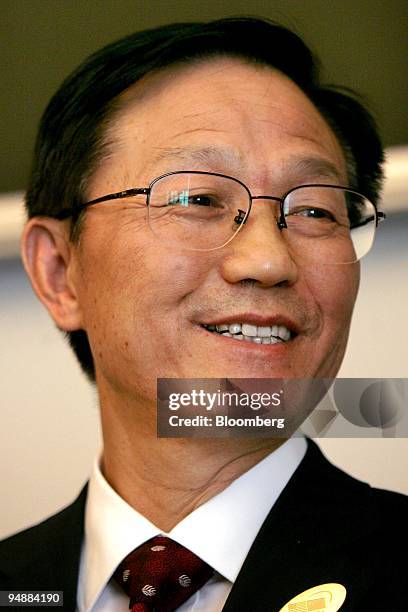 Xie Xuren, China's finance minister, smiles while speaking during the fourth meeting of the U.S.-China Strategic Economic Dialogue held at the U.S....