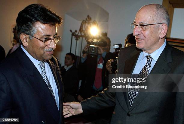 Pascal Couchepin, president of the Swiss confederation and federal councilor of home affairs, right, welcomes Pervez Musharraf, president of...