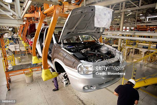 The General Motors Corsa vehicles move down the assembly line at their manufacturing facility in Rosario, Argentina, on Thursday, March 6, 2008. The...